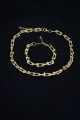Gold Renk Kadın Kalın Zincir Takı Seti Kolye ve Bileklik 2li Gold Renk Kadın Kalın Zincir Takı Seti Kolye ve Bileklik 2li