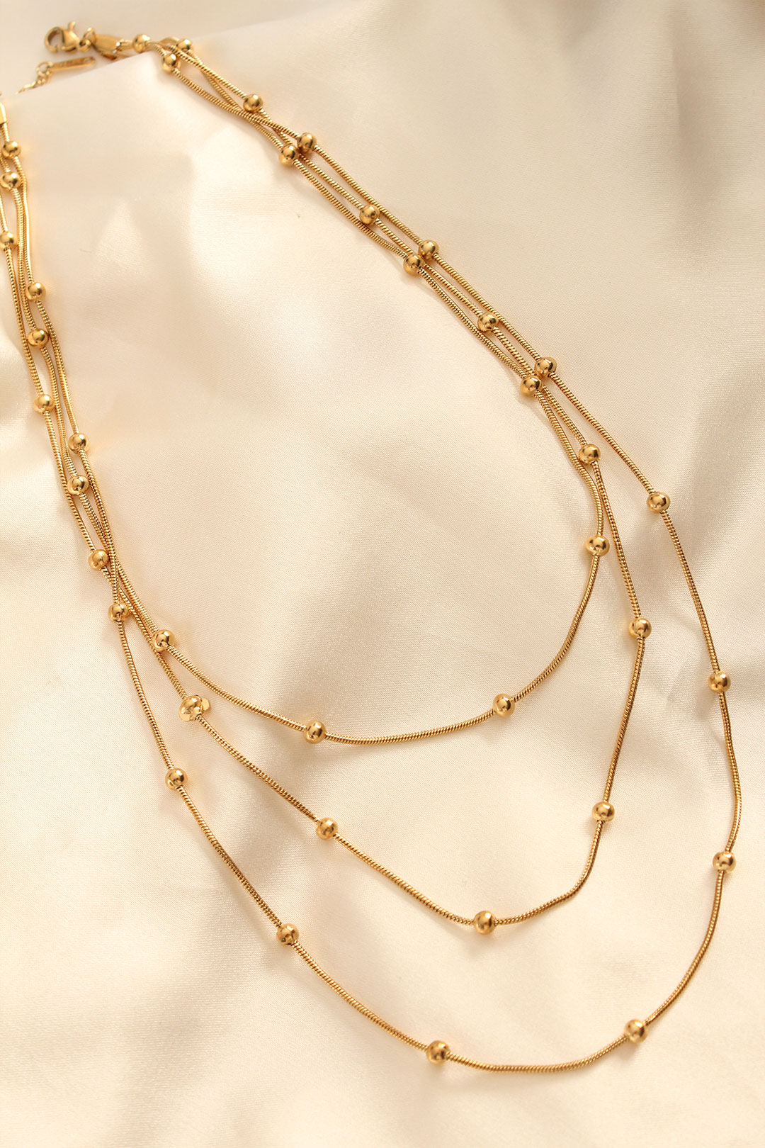 Çelik Altın Renkli Topçuk Tasarımlı Çoklu Kolye - Lisinya Çelik Altın Renkli Topçuk Tasarımlı Çoklu Kolye - Lisinya