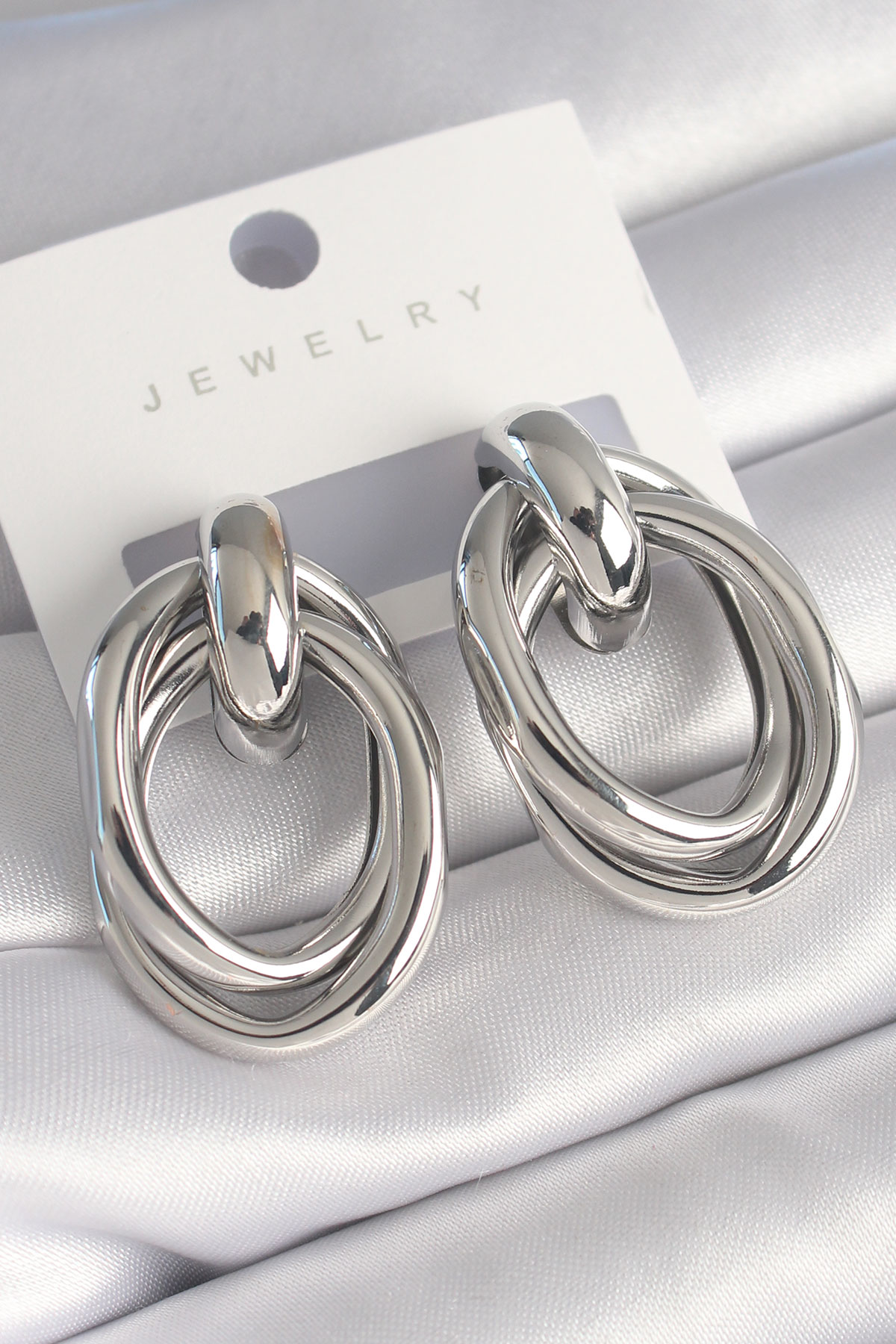 Pirinç Gümüş Renk Oval Sarmal Model Kadın Küpe - Lisinya Pirinç Gümüş Renk Oval Sarmal Model Kadın Küpe - Lisinya